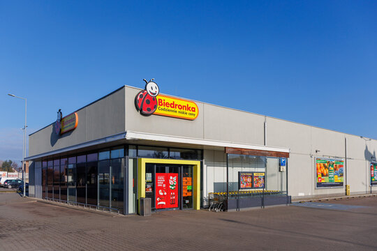 Zarow, Poland &ndash; December 26, 2025: Angled view of a Biedronka supermarket building with glass facade and entrance area.