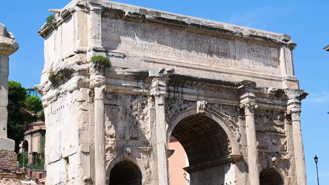 ancient roman triumphal arch marble facade carved relief scenes fluted columns centuries weathering appear under daylight rome up close view italy empire emperor fa ade 