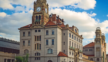 Main railway station building in Prague with clock.