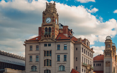 Main railway station building in Prague with clock.