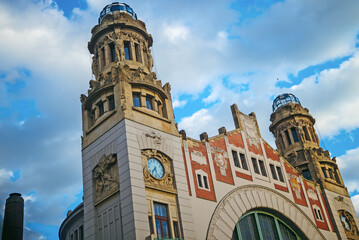 Main railway station building in Prague with clock.