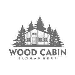 Wooden house icon. A black and white illustration of a house on a hill surrounded by evergreen trees.