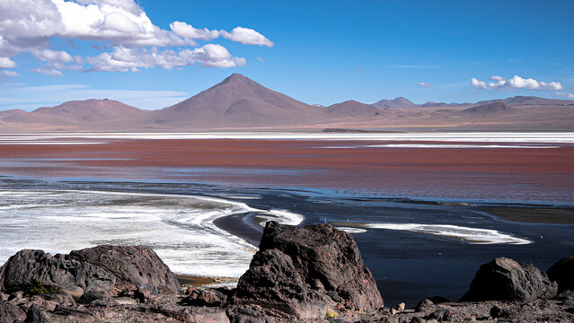 Laguna colorada ecosystem with andes mountains and sky - Powered by Adobe
