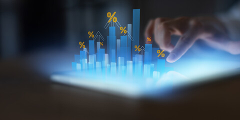 Financial Growth and Rising Interest Rates Visualization on Digital Tablet.