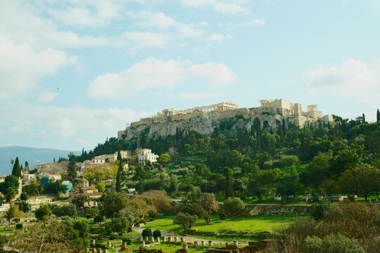 The Parthenon temple on the Acropolis hill with scaffolding during restoration, viewed from the Ancient Agora in Athens, Greece.