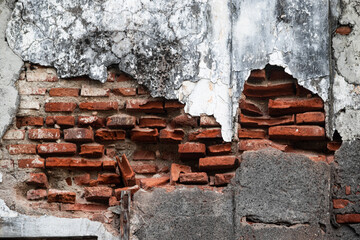 Old Brick Wall with Cracked Plaster and Peeling Paint Texture Background