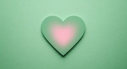 Fototapeta premium Green heart shape with soft pink center on textured background