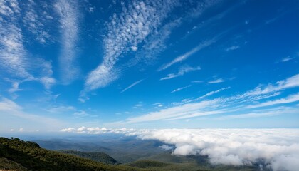 Fototapeta premium Vast Expanse Of Blue Sky Dotted With Fluffy White Clouds Creating A Dramatic And Serene Landscape Perfect For Travel Nature And Weather Related Projects Above Cirrus Atmosphere
