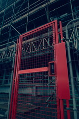 Red gate at entrance to the building site