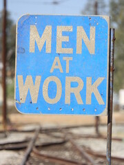 An old Men at Work sign