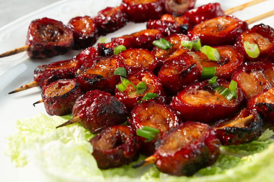 A closeup view of pork isaw, on a plate.