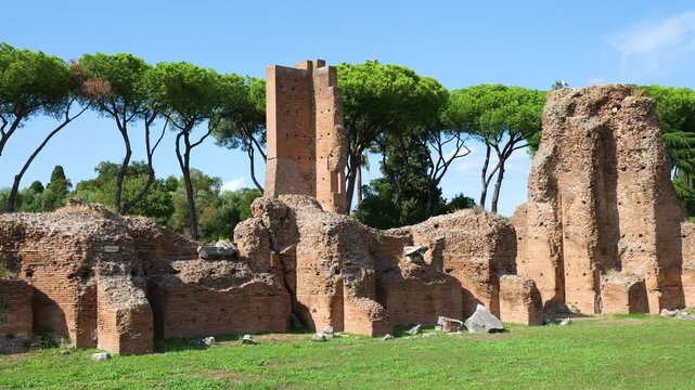 towering ancient roman brick ruins rise partially standing walls rectangular structure umbrella pine trees frame house augustus to rome italy empire emperor of 