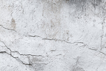 Fototapeta premium cracked old white plaster wall texture background