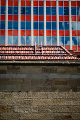Ladder on a red-tile roof and Red and blue building, Hobart, Tasmania, Australia