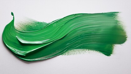 abstract green paint stroke on white canvas creates textured artistic expression