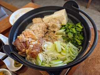 Tori Paitan Nabe Teishoku (Japanese chicken hot pot) in a restaurant setting. 
