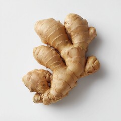 A high-resolution studio shot of a fresh, intact piece of ginger root. The ginger has a light brown, slightly textured skin with visible nodes and an organic, knobbly shape. 