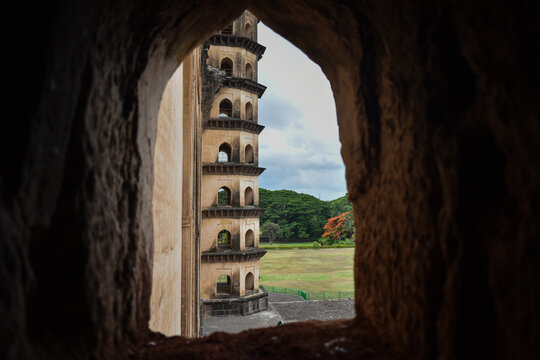 A window view of Golgumbazz minarets  - Powered by Adobe
