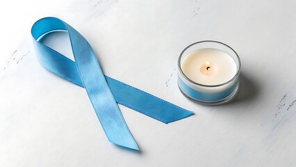 Cancer awareness flat lay with blue ribbon and candle symbolizing hope