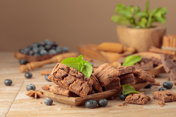 Brownie with fresh blueberries and mint.