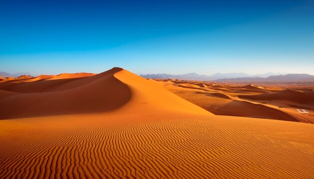 vast desert landscape with golden sand dunes under a clear blue sky - Powered by Adobe