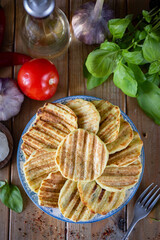 A hearty lunch: Grilled zucchini fritters. Vegetable fritters for dinner. Close-up. Vertical photo