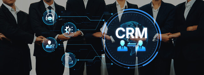 A professional business team stands together showcasing customer relationship management tools and ideas, emphasizing teamwork and modern technology in the marketing landscape. Trope