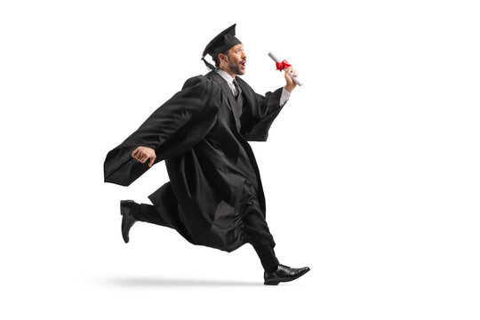 Excited male graduate student running in cap and gown and holding a diploma
