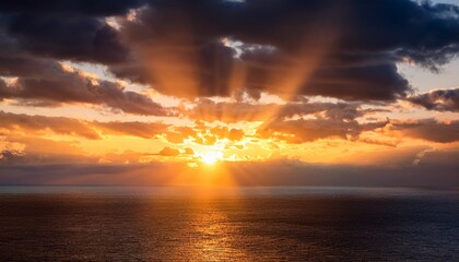 Golden Hour Sunset Over Ocean The Sun S Rays Peaking Through Clouds In The Sky