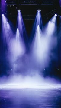 An empty stage bathed in purple light, ready for a performance