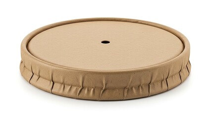 Brown fabric covered foam cushion with ruched edges and central hole for outdoor furniture isolated on white background