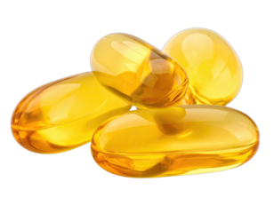 Close-up of glossy, amber-colored softgel capsules against a stark black background