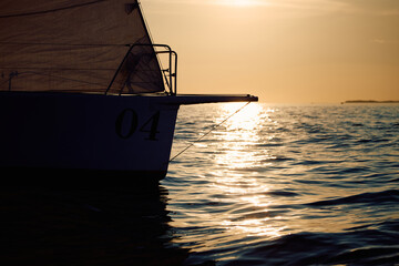 bow of a sailing boat with bowsprit at sailing regatta in the Gulf of Finland at sunset, sailing...