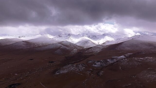 Snowy Mountain Range Kyrgyzstan Storm Clouds Aerial View