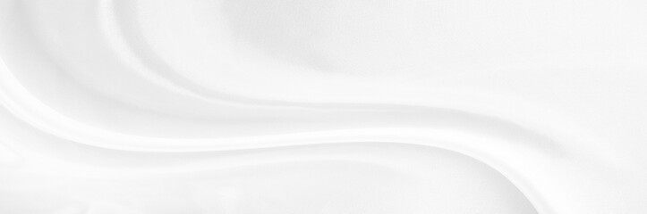 White gray satin texture that is white silver fabric silk panorama background with beautiful soft blur pattern natural.