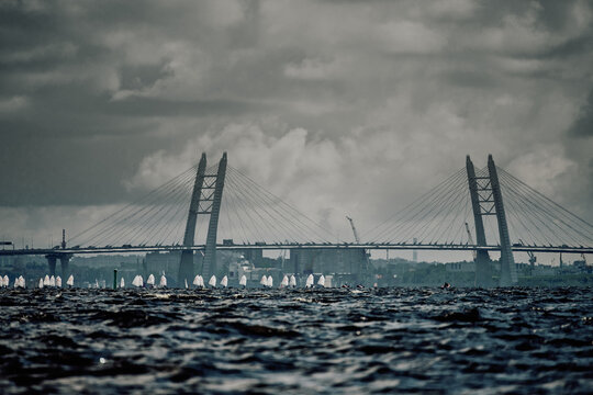 Students of the academy of sailing on shwertboats in cloudy weather, Russia, St. Petersburg