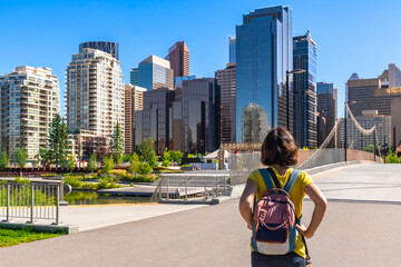 Young tourist admiring calgary skyline in canada on sunny day