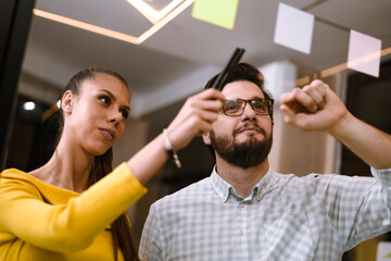 Collaborative brainstorming session in a modern office space during a creative workshop with focus on teamwork and innovation