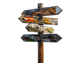 Weathered wooden directional signpost with multiple arrow-shaped signs against a black backdrop