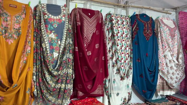 traditional indian kurtis hanging on clothing rack in local shop