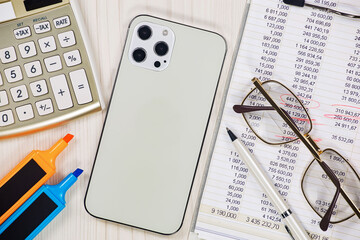 Business and accounting supplies arranged in a composition on an office desk. Top view.