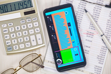 Business and accounting supplies arranged in a composition on an office desk. Top view.