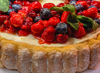 Cheesecake with Fresh Berries and Mint Garnish Elegant Summer Dessert Closeup Sweets Background 