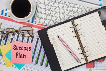 Business and accounting supplies arranged in a composition on an office desk. Top view.