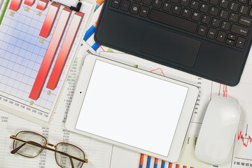 Business and accounting supplies arranged in a composition on an office desk. Top view.