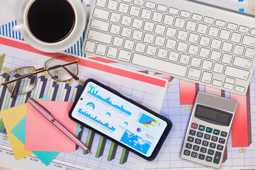 Business and accounting supplies arranged in a composition on an office desk. Top view.