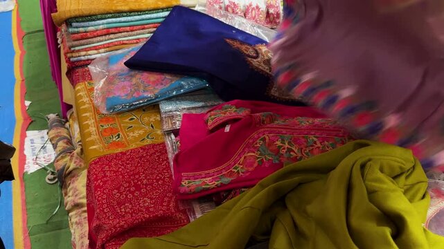 ethnic kurti material showcased at handicraft market to customer