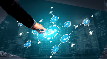 A hand reaches out to a glowing digital interface, symbolizing data connection and technology innovation, with urban scenery in the background representing modernity. Tessel