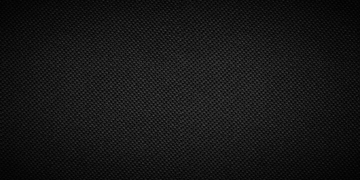 Black fabric material background texture. Luxury dark canvas cloth with subtle fiber pattern.