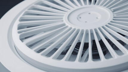 A white fan with a black background